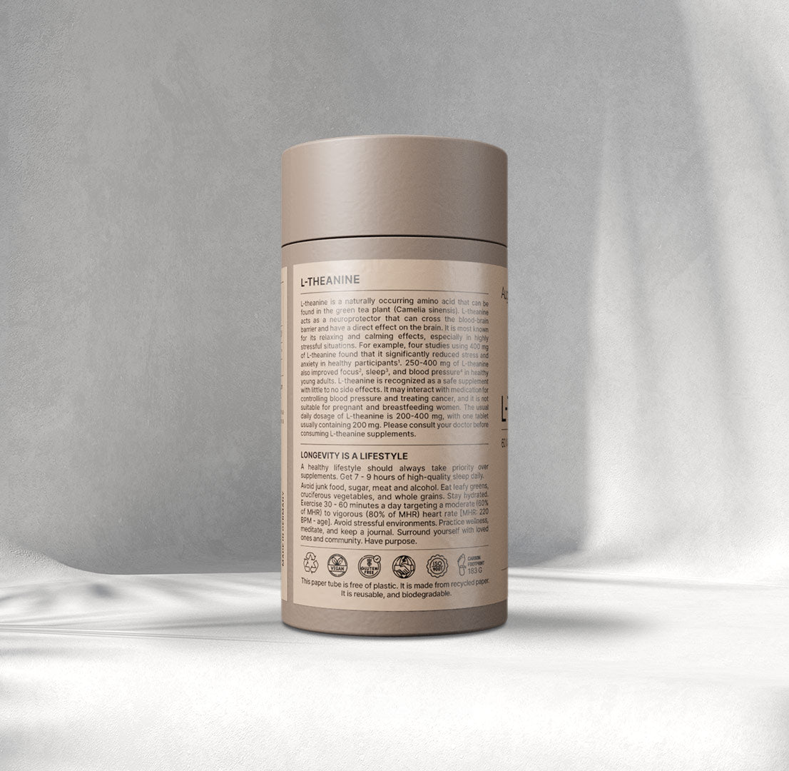 A beige cylindrical container labelled "L-Thea nine, 60 x 400 mg capsules" by Augment Life sits on a softly lit Gray background, exuding a calm, minimalist vibe.